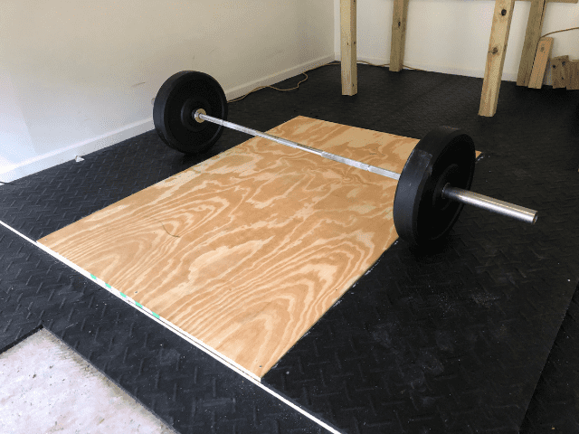 Lifting Platform with a Barbell and Bumper Plates